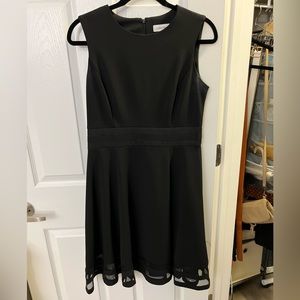 Calvin Klein black dress size 8 with sheer details.